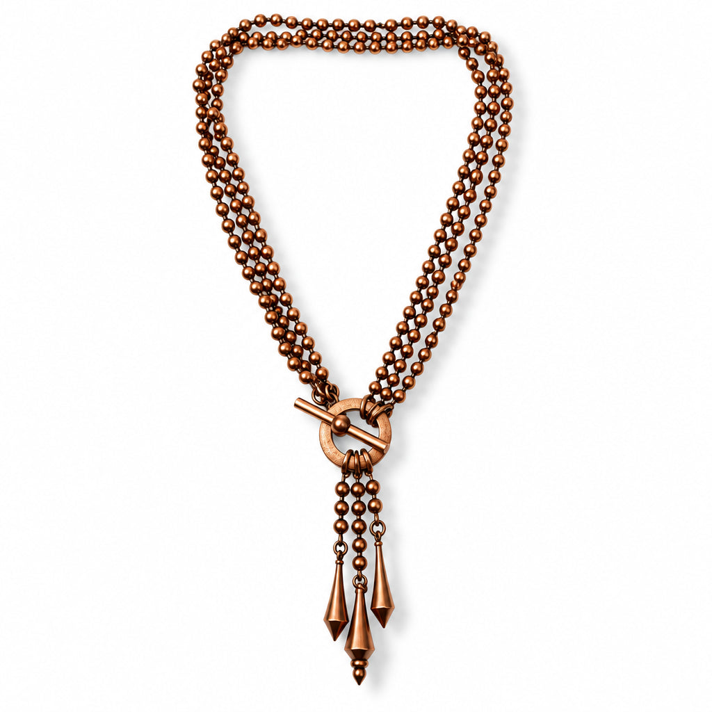 Copper beaded necklace with a toggle clasp on a white background