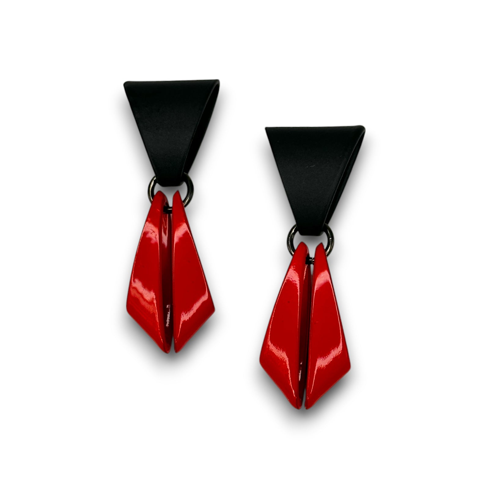 Pair of earrings with black and red geometric design on a white background