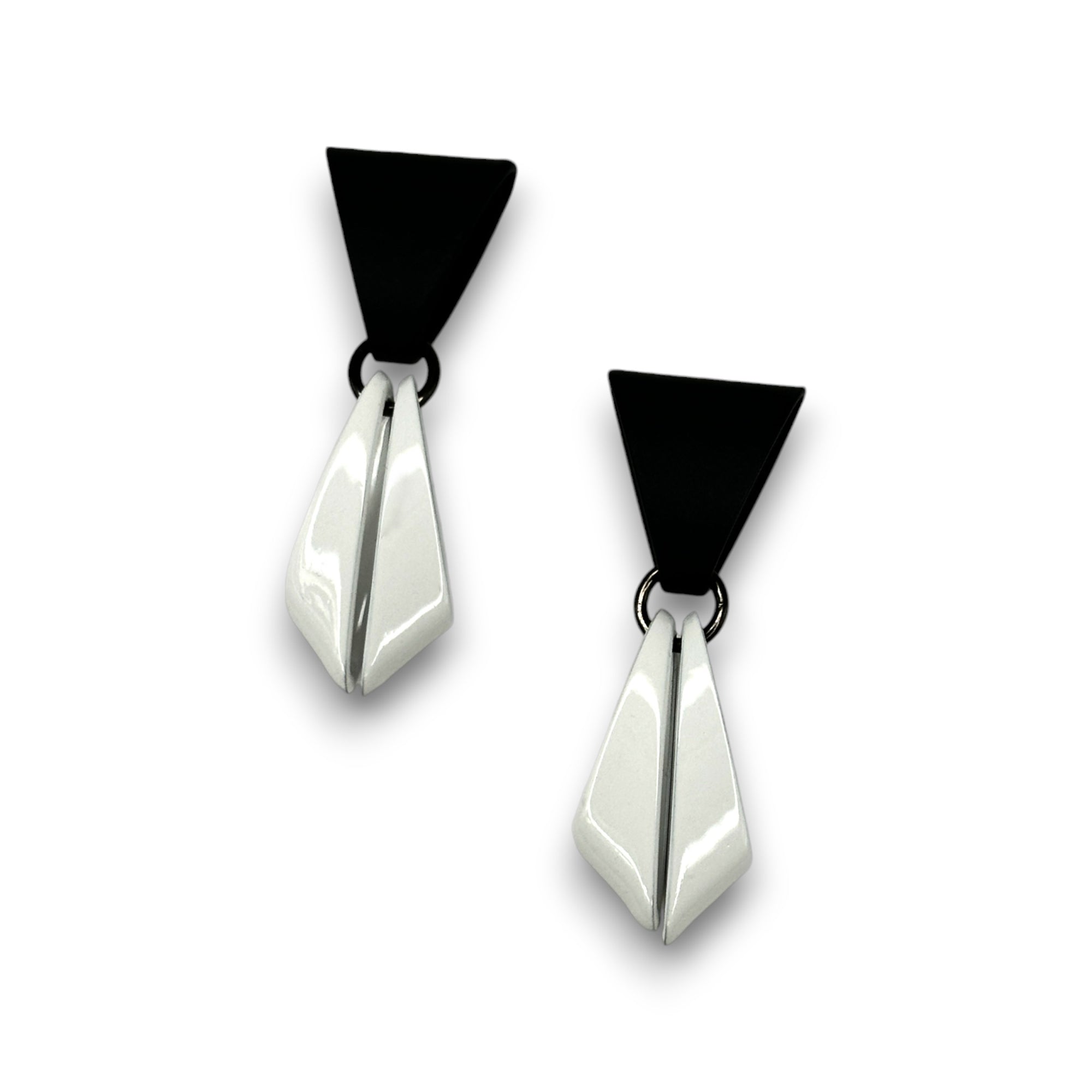Pair of earrings with black and white geometric design on a white blackground