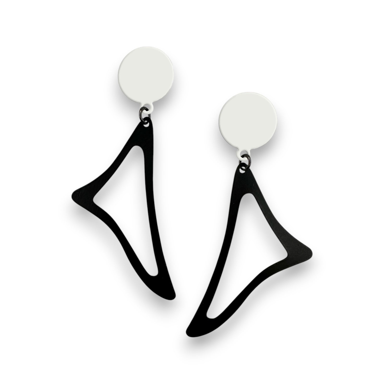 Black geometric earrings with white circular tops on a white background