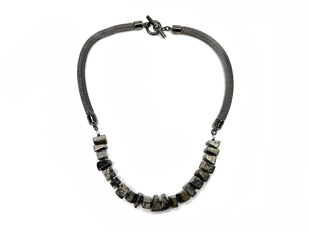 Erica Zap Designs gunmetal mesh necklace featuring rough-cut goldstone beads and a toggle clasp closure.